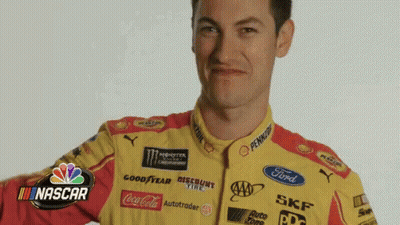 A Man Is Wearing A Yellow And Red Racing Uniform With Nascar Logos On It GIF
