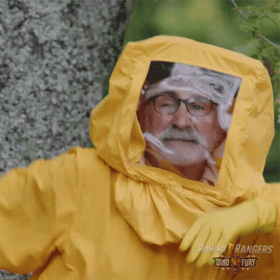 A Man Is Wearing A Yellow Power Rangers Costume GIF