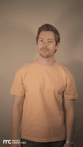A Man Is Wearing An Orange Shirt That Says Yes Queen Slay GIF