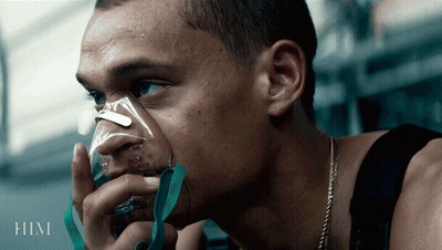 A Man Is Wearing An Oxygen Mask And The Word Him Is On The Bottom GIF