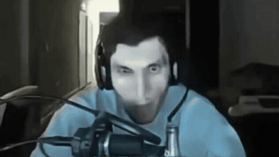 A Man Is Wearing Headphones And A Microphone GIF