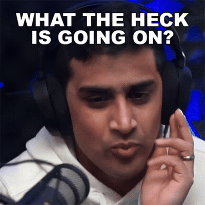 A Man Is Wearing Headphones And Asking What The Heck Is Going On GIF