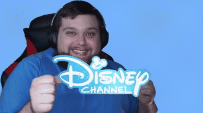 A Man Is Wearing Headphones And Holding A Disney Channel Sign GIF
