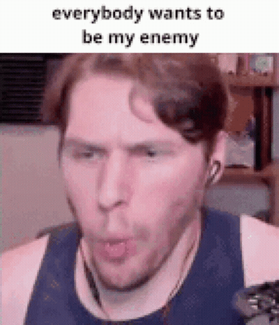 A Man Is Wearing Headphones And Making A Funny Face While Talking On A Video Call . GIF