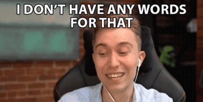 A Man Is Wearing Headphones And Smiling While Sitting In A Chair . GIF