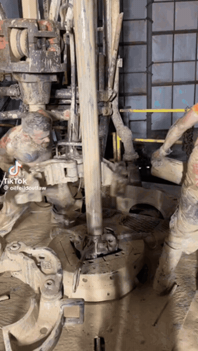 A Man Is Working On A Machine That Says Tik Tok On It GIF