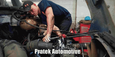 A Man Is Working On The Engine Of A Truck With The Words Pratek Automotive Written Below Him GIF