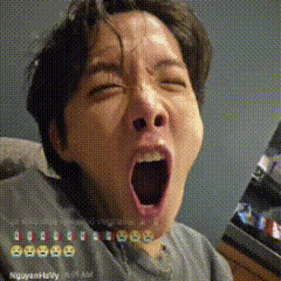 A Man Is Yawning With His Mouth Open In A Pixelated Photo . GIF