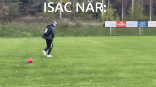 A Man Kicking A Soccer Ball On A Field With The Word Isaac Nar Written Above Him GIF