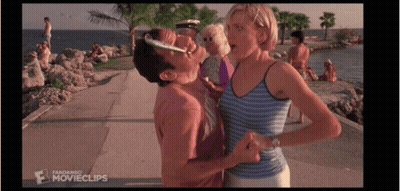 A Man Kissing A Woman On The Cheek In A Movie Clip GIF