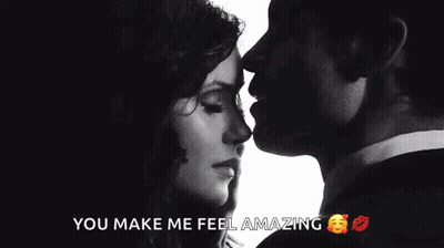 A Man Kissing A Woman On The Forehead With The Words You Make Me Feel Amazing Below Them GIF