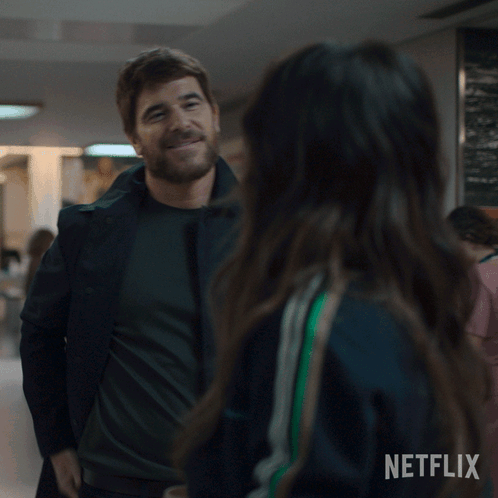 A Man Kissing A Woman With A Netflix Logo On The Bottom Right GIF