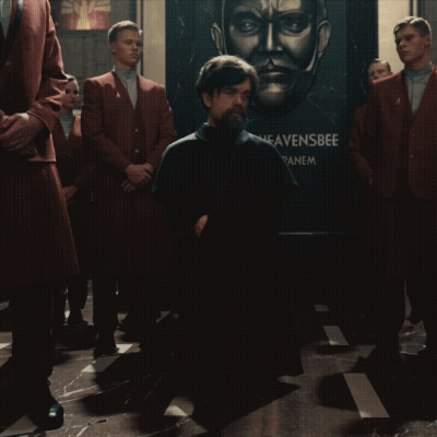 A Man Kneeling In Front Of A Heavensbee Sign GIF
