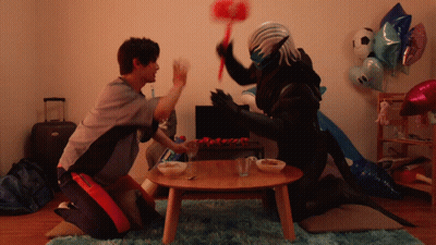 A Man Kneeling Next To A Monster With A Hammer GIF