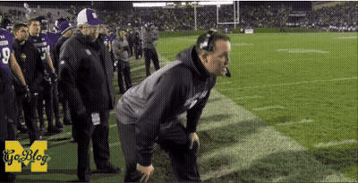 A Man Kneeling On A Football Field With A Goblog Logo On The Bottom GIF