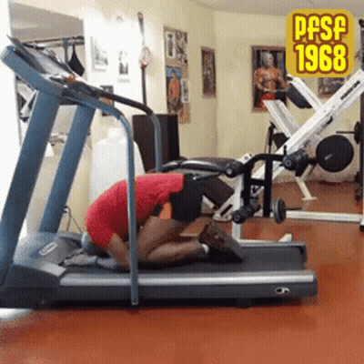 A Man Kneeling On A Treadmill In A Gym With The Year 1968 On The Bottom GIF