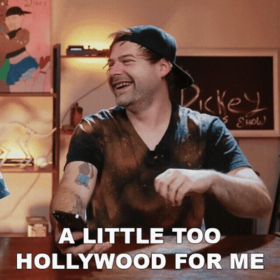 A Man Laughs While Holding A Cell Phone With The Words A Little Too Hollywood For Me GIF