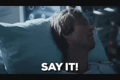 A Man Laying In A Hospital Bed With The Words Say It Below Him GIF