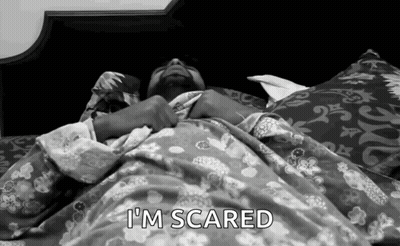A Man Laying In Bed With The Words I 'M Scared Written Above Him GIF