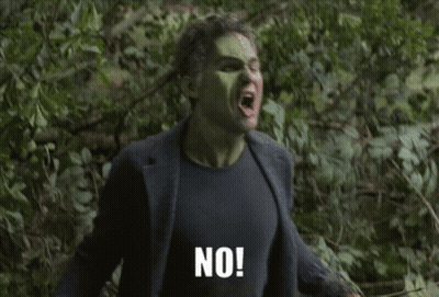 A Man Laying In The Grass With The Words " What Do You Mean " Written Below Him GIF