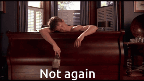 A Man Laying On A Bed With A Bottle Of Whiskey And The Words " Not Again " Above Him GIF