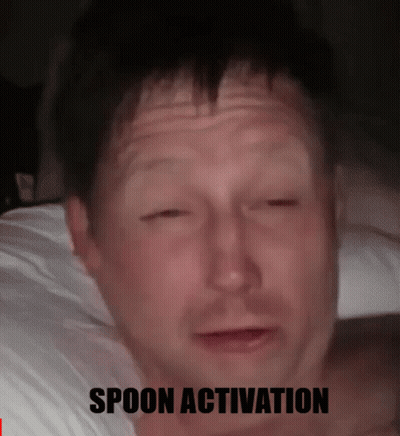 A Man Laying On A Bed With His Eyes Closed And The Words Spoon Activation Below Him GIF