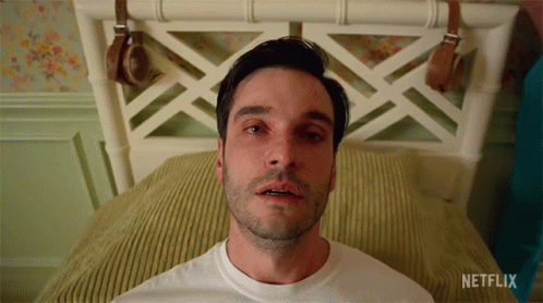 A Man Laying On A Bed With Netflix Written On The Bottom GIF