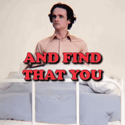 A Man Laying On A Bed With The Words " And Find That You " Written Above Him GIF