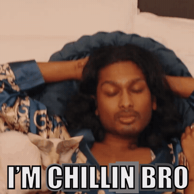 A Man Laying On A Bed With The Words I 'M Chillin Bro Written Above Him GIF