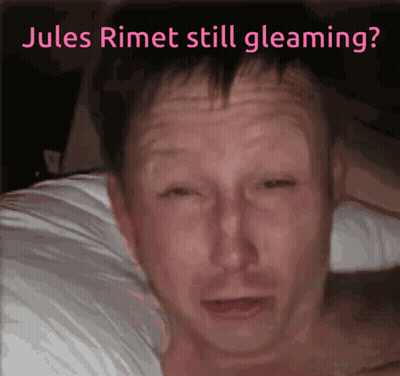 A Man Laying On A Bed With The Words Jules Rimet Still Gleaming GIF