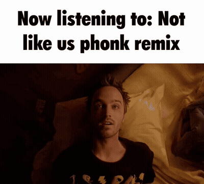 A Man Laying On A Bed With The Words Now Listening To : Not Like Us Phonk Remix Above Him GIF