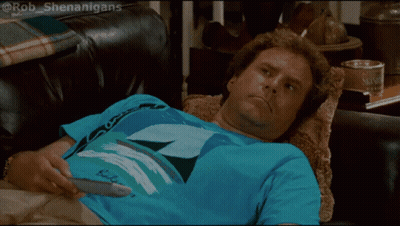 A Man Laying On A Couch Wearing A Blue Shirt That Says ' Bob ' On It GIF