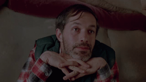 A Man Laying On A Couch With The Words " My Art " Above Him GIF