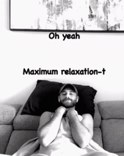A Man Laying On A Couch With The Words Oh Yeah Maximum Relaxation-T On The Bottom GIF