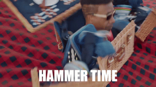 A Man Laying On A Picnic Blanket With The Words Hammer Time Written On The Bottom GIF