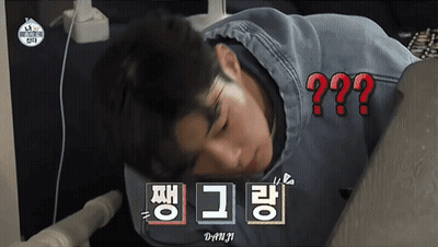 A Man Laying On His Stomach With A Question Mark Above Him In Red GIF
