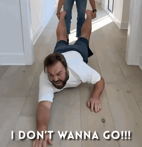 A Man Laying On The Floor With The Words I Don 'T Wanna Go GIF