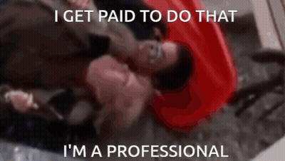 A Man Laying On The Floor With The Words I Get Paid To Do That I 'M A Professional Written Below Him GIF