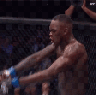 A Man Laying On The Ground In A Boxing Ring With The Word Modelo On The Wall Behind Him GIF