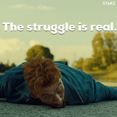 A Man Laying On The Ground With The Words " The Struggle Is Real " Written Above Him GIF