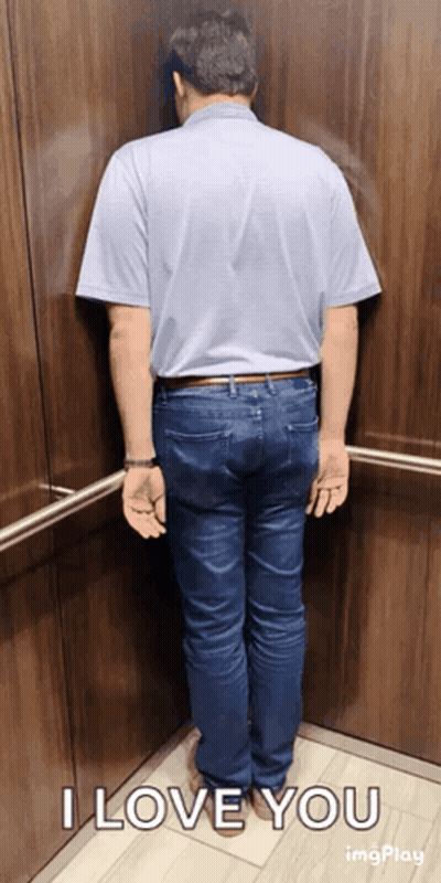 A Man Leaning Against A Wall In An Elevator With The Words I Love You On The Bottom GIF