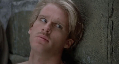 A Man Leaning Against A Wall With The Words " Who Are You " Above Him GIF