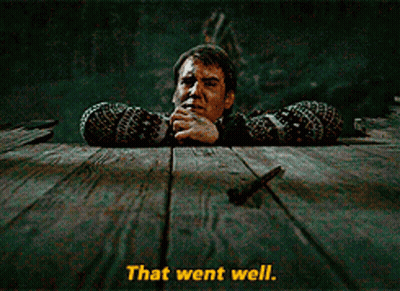A Man Leaning Over A Wooden Table With The Words That Went Well Written Below Him GIF