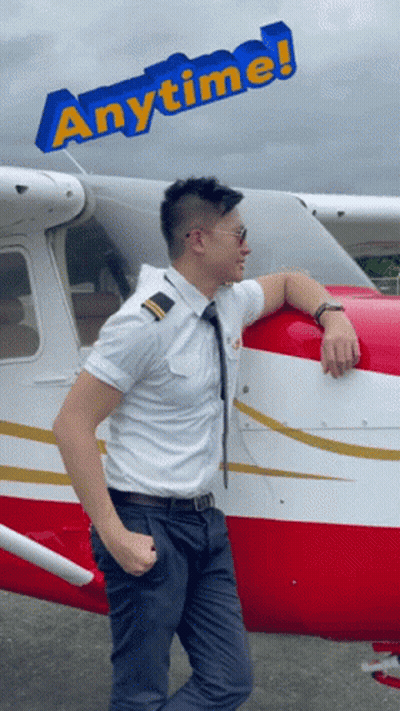 A Man Leans On The Side Of A Plane With The Words Anytime Behind Him GIF