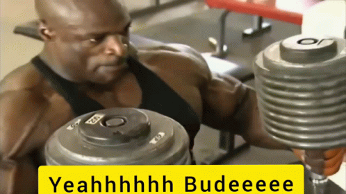 A Man Lifting A Dumbbell In A Gym With The Words Yeahhhhh Budeeee On The Bottom GIF