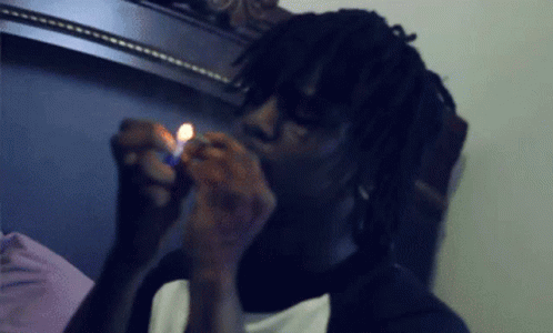 A Man Lighting A Cigarette With A Lighter GIF