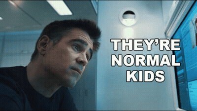 A Man Looking At A Computer Screen With The Words " They 'Re Normal Kids " Behind Him GIF