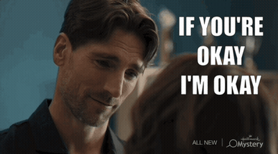A Man Looking At A Woman With The Words If You 'Re Okay I 'M Okay On The Bottom GIF