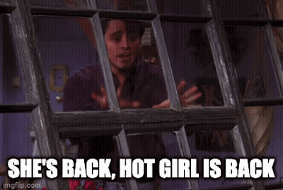 A Man Looking Out A Window With The Words She 'S Back Hot Girl Is Back Written Below Him GIF
