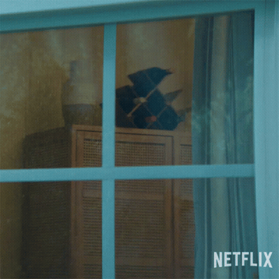 A Man Looking Out Of A Window With A Netflix Logo In The Corner GIF